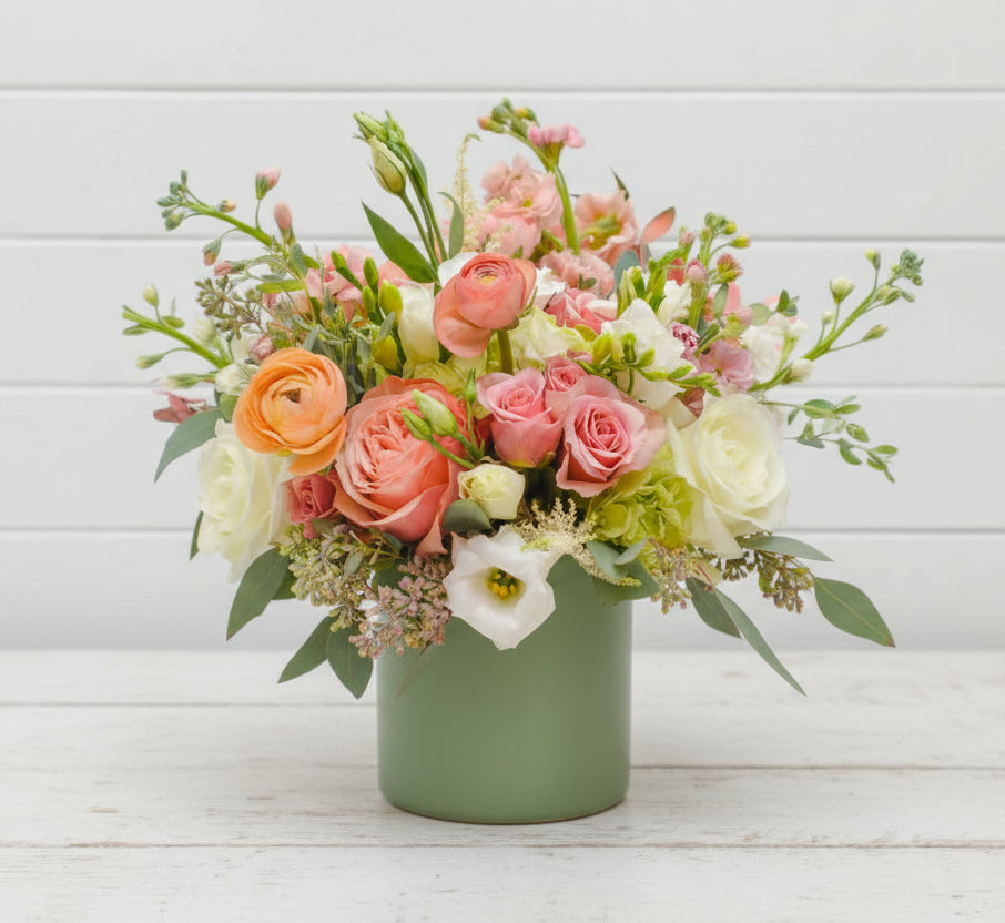 Floral arrangement in a vase on a light background